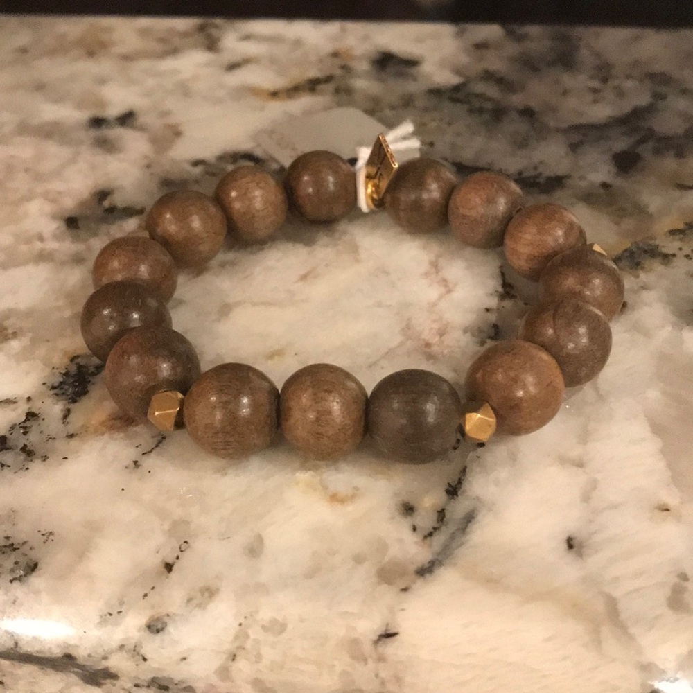 Wooden stretch bracelet with three gold Accents